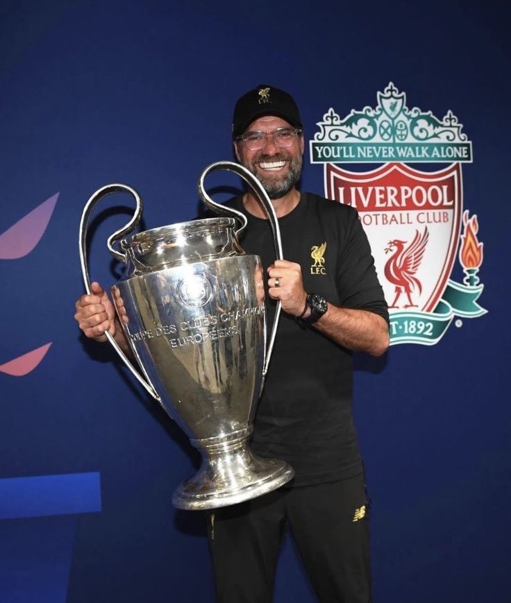 Klopp poses with the UCL trophy after Liverpool won it in 2019. 