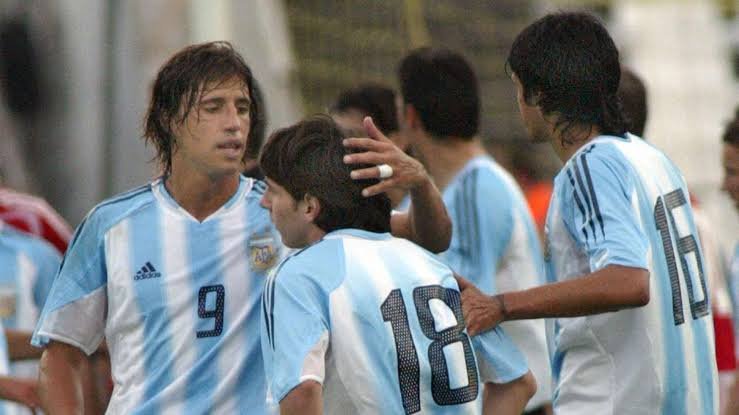 18 year old Lionel Messi being consoled by his teammates after being sent off less than a minutes into his debut for Argentina